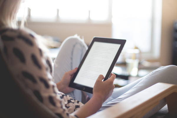 person holding e-reader